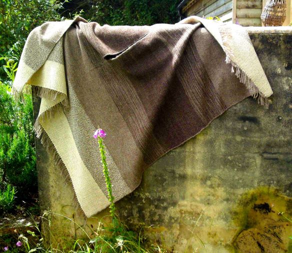 Rodolpi poncho draped on wall enhanced
