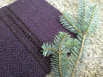 Purple alpaca and Jacob snug with fir